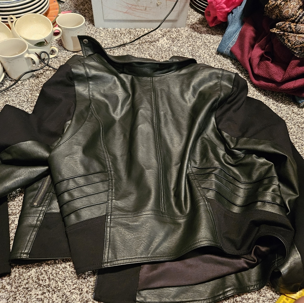 Torrid. Size 3 Faux Leather jacket. Black. Has zippers and pockets. This Is A 3X
